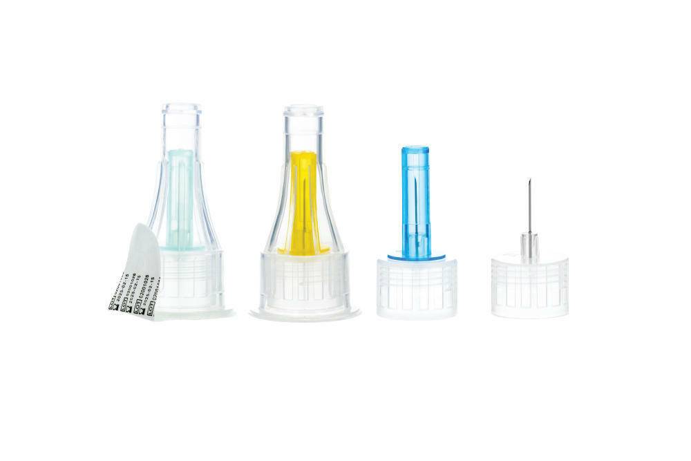 A set of Sol-M pen needles displayed in different colors, each with a white needle attached.