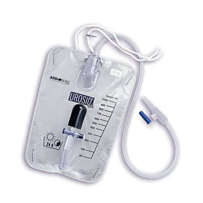 A transparent urinary drainage leg bag system with measurement markings, a drainage valve, and an attached tube, against a white background.